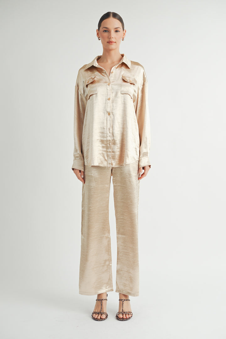 Women Wholesale brand Metallic Pants The elastic waist ensures a customizable and flattering fit, while the wide-leg silhouette adds a touch of modern flair.