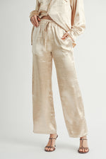 Load image into Gallery viewer, Metallic Pants The elastic waist ensures a customizable and flattering fit, while the wide-leg silhouette adds a touch of modern flair.
