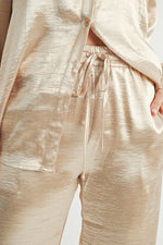 Load image into Gallery viewer, Women Wholesale brand Metallic Pants The elastic waist ensures a customizable and flattering fit, while the wide-leg silhouette adds a touch of modern flair.
