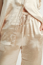 Women Wholesale brand Metallic Pants The elastic waist ensures a customizable and flattering fit, while the wide-leg silhouette adds a touch of modern flair.