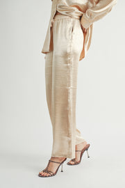 Women Wholesale brand Metallic Pants The elastic waist ensures a customizable and flattering fit, while the wide-leg silhouette adds a touch of modern flair.