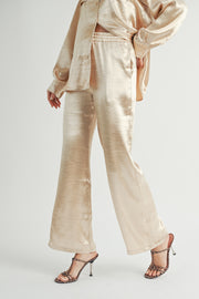 Women Wholesale brand Metallic Pants The elastic waist ensures a customizable and flattering fit, while the wide-leg silhouette adds a touch of modern flair.