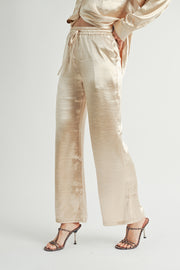 Women Wholesale brand Metallic Pants The elastic waist ensures a customizable and flattering fit, while the wide-leg silhouette adds a touch of modern flair.