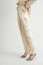 Women Wholesale brand Metallic Pants The elastic waist ensures a customizable and flattering fit, while the wide-leg silhouette adds a touch of modern flair.